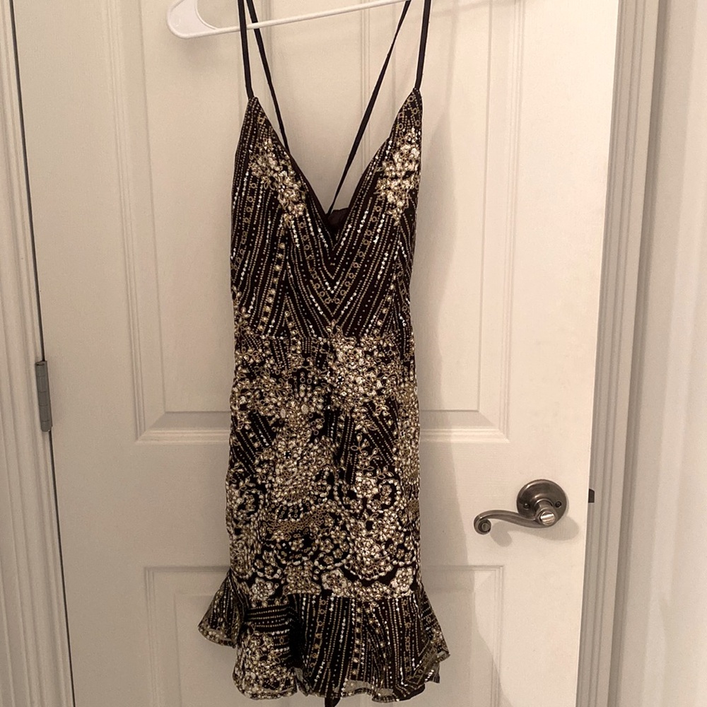 Lulus Black glitter ruffled lace up mini party dress.